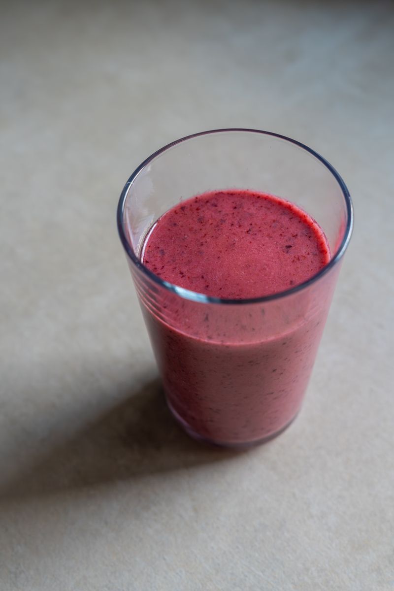 Glass of purple berry smoothie